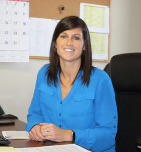 Crystal's office headshot as part of the S&K Roofing team, highlighting her professional role.